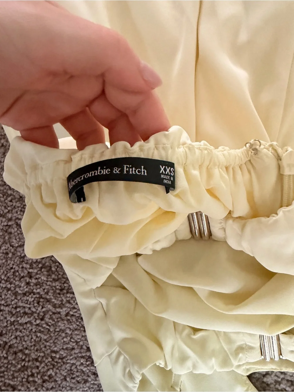 Yellow satin gown with floral accent